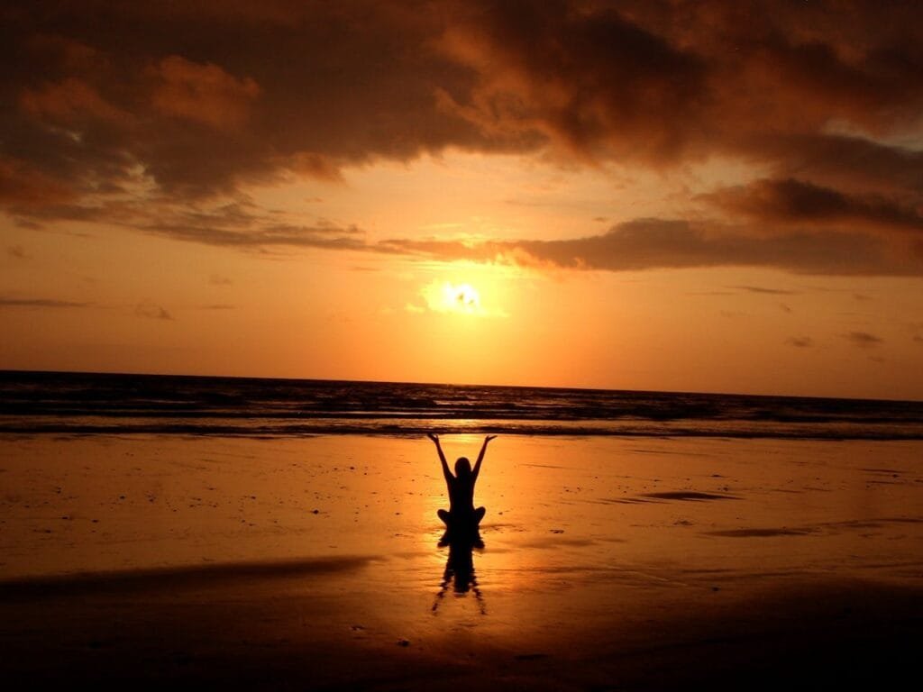 pexels-photo-268134 Peaceful meditation silhouette at sunset on a serene beach.